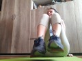 Sweaty feet after workout. Stinky socks and sneakers.Sniffing - OlgaNovem