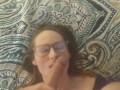 Hottie in glasses licks balls and gets cum on her face POV