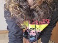 Brown eyed curly hair in hoody playing with self