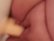 Chubby chick bounces on dildo