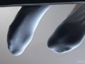 Legs in white socks on the table