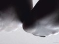 Legs in white socks on the table