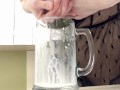 Sexy milf in lingerie squirting breastmilk into cup