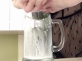 Sexy milf in lingerie squirting breastmilk into cup