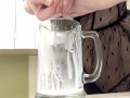 Sexy milf in lingerie squirting breastmilk into cup
