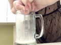 Sexy milf in lingerie squirting breastmilk into cup