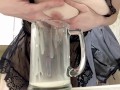 Sexy milf in lingerie squirting breastmilk into cup