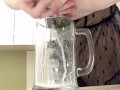 Sexy milf in lingerie squirting breastmilk into cup