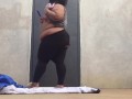 Bbw having fun at outdoor racquetball court while people play close by