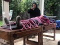 Wool mohair layers of sweaters on a bondage table 