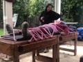 Wool mohair layers of sweaters on a bondage table 