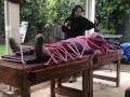 Wool mohair layers of sweaters on a bondage table 