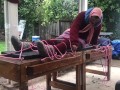 Wool mohair layers of sweaters on a bondage table 