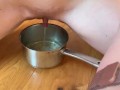 Escort Emma fills up two cups with piss and keeps going