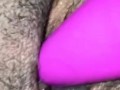 Playing with her hairy pink pussy