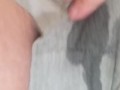 Milf pissing in  her grey shorts 