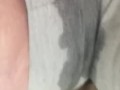Milf pissing in  her grey shorts 