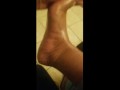 Ebony feet oil massage. 