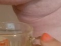 Bbw encouraged to pee more into glass
