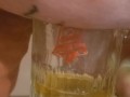 Bbw encouraged to pee more into glass