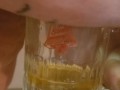 Bbw encouraged to pee more into glass