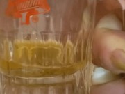 Bbw encouraged to pee more into glass