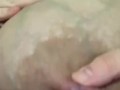 Hand expressing my breastmilk 