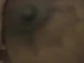 Ebony black girl sucking her own huge boobs