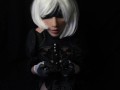 Silicone doll with 2B cosplay gives blowjob to strapon