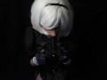Silicone doll with 2B cosplay gives blowjob to strapon