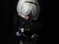 Silicone doll with 2B cosplay gives blowjob to strapon