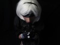 Silicone doll with 2B cosplay gives blowjob to strapon