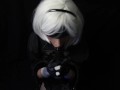 Silicone doll with 2B cosplay gives blowjob to strapon