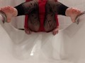 Wetting fishnet leggings feet in a bathtub