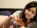 Bored Girl Chews On Pizza