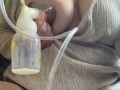 Milkymama pumps milk filled tits while rubbing hairy pussy