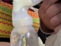 Milkymama pumps milk filled tits while rubbing hairy pussy