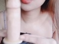 Hot asian Try to put condom using her mouth on her Strap-on dildo and fuck it