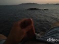 Skinny guy masturbates on a cliff during a sunset in Ibiza