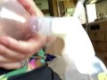 Milkymama in a bathing suit pumps milk filled tits while camping 
