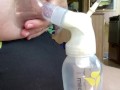 Milkymama in a bathing suit pumps milk filled tits while camping 
