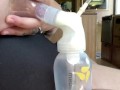 Milkymama in a bathing suit pumps milk filled tits while camping 