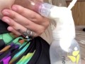 Milkymama in a bathing suit pumps milk filled tits while camping 