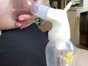 Milkymama in a bathing suit pumps milk filled tits while camping 