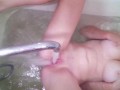 Teen masturbates pussy with a stream of water in the bathroom
