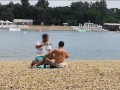 Milf Lilly naked on public beach got oil massage from stranger