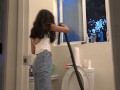 Bombshell Desi Girl Vacuuming the Bathroom in Crop Top and Jeans