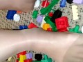 Sexy nylon feet walking on legos