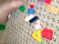 Sexy nylon feet walking on legos