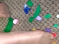 Sexy nylon feet walking on legos